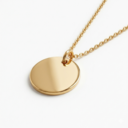 Gold necklace with a round pendant on a white background