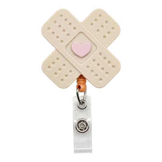 Bandaid-shaped badge holder with a heart and white background