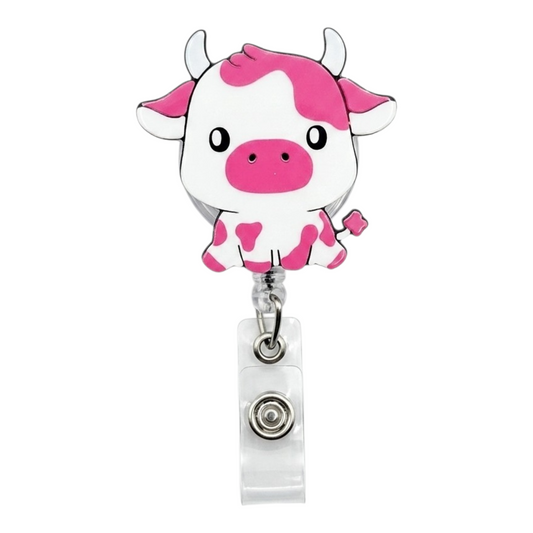 Retractable badge holder with a cow design on a white background